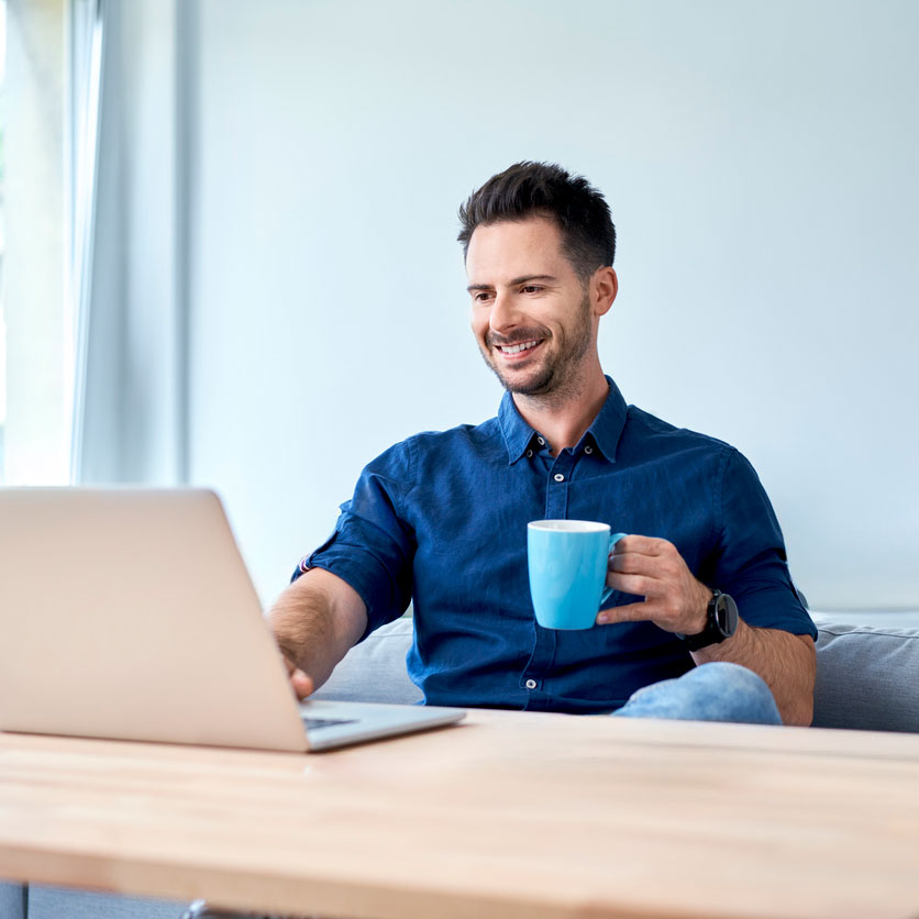 Man watching public meeting video at home