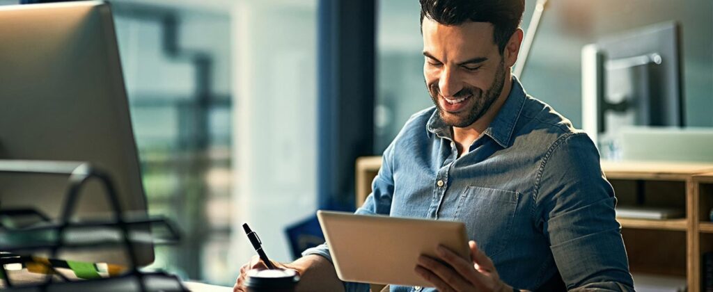 Guy looking at tablet