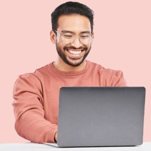 Young Asian-American man interacting with a government survey on his laptop