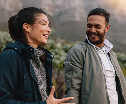 Two people discussing ideas outdoors