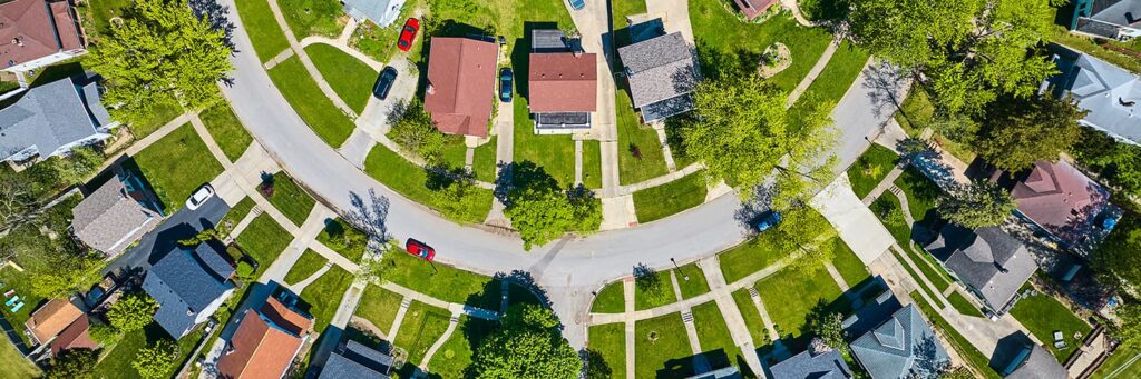 Aerial view of a neighborhood with family homes and short-term rentals on a circular street