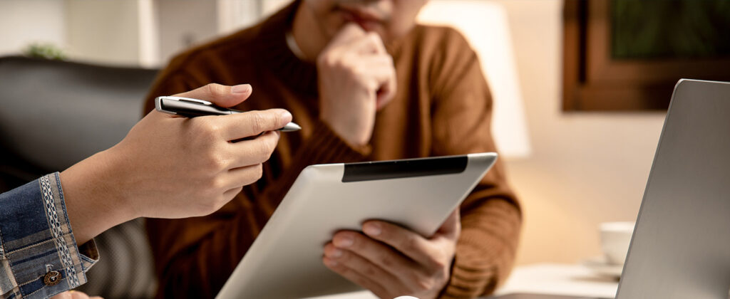 Two people looking at ipad